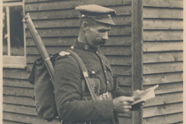 World War One soldier holding a letter